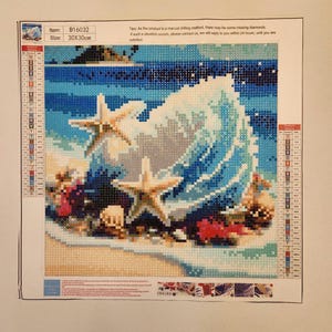 May include: Diamond painting kit depicting a beach scene with a seashell, starfish, and waves. The artwork is made of small, colourful diamond-shaped pieces. The size is 30x30cm.