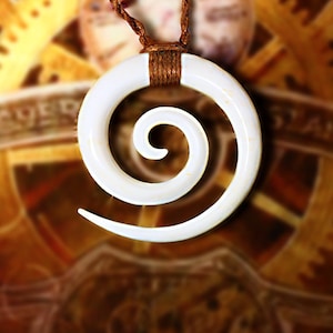 May include: A white spiral pendant necklace with a brown cord. The pendant is a smooth, curved spiral shape. The necklace is a piece of jewelry.