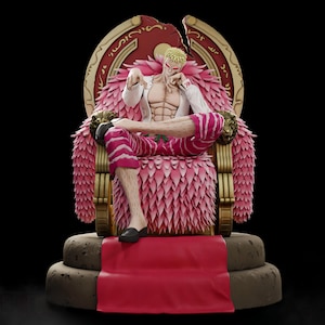 May include: A collectible figurine of a blonde character with spiky hair, wearing a white open shirt and pink-and-white striped trousers, sitting on a large, ornate gold-and-red throne with pink feather-like accents, set on a circular base.