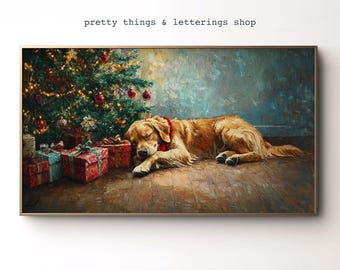 May include: A framed painting depicts a sleeping golden retriever wearing a red scarf, resting near a decorated Christmas tree and wrapped gifts. The artwork has a warm color palette with the text "pretty things & letterings shop" at the top.