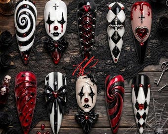 May include: A set of ten long, pointed press-on nails featuring gothic designs including black and white spirals, clown faces, red and black corset lacing, silver crosses, red hearts, and harlequin patterns, all accented with small red gems.