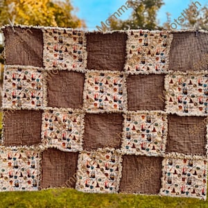 May include: A patchwork quilt with a brown and cream color scheme. The quilt features alternating squares of brown gingham and cream fabric printed with witch hats, brooms, and other Halloween-themed images. The edges are frayed.