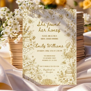 May include: Bridal shower invitation with a honeybee theme. The invitation features the text "She found her honey" and details for the event, including the date, time, and location. The design includes illustrations of bees, honeycombs, and flowers.