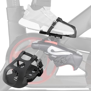 May include: Black exercise bike pedal with adjustable straps. The pedal is designed to secure the user's foot to the bike pedal. The image shows the pedal attached to a shoe and a stationary bike.