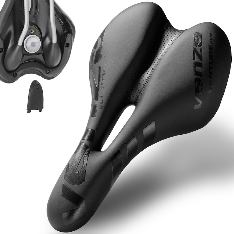 May include: A black bicycle seat with the text "venzo VENTURE pro" and "VENTURE" printed on it. The seat has a split design with a perforated center section. A small black component is also visible.