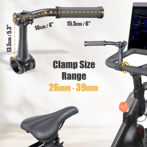 May include: Black exercise bike handlebar with measurements: 10cm/4", 15.5cm/6", and 13.5cm/5.3". The text "Clamp Size Range 26mm-39mm" is displayed. The image also shows a bike seat and a screen.