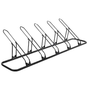 May include: A black metal bike rack with five slots. The rack has a rectangular base and angled supports for each bike. The supports are curved at the top to hold the bike wheels. The rack is designed to hold multiple bicycles.