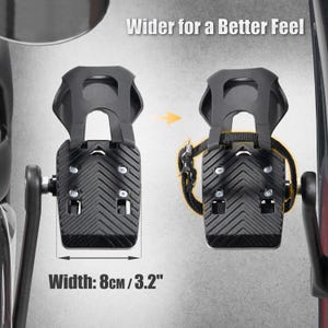 May include: Black bicycle pedals with a textured surface and a strap. The image shows the width of the pedal is 3.2 inches. The text on the image says "Wider for a Better Feel."