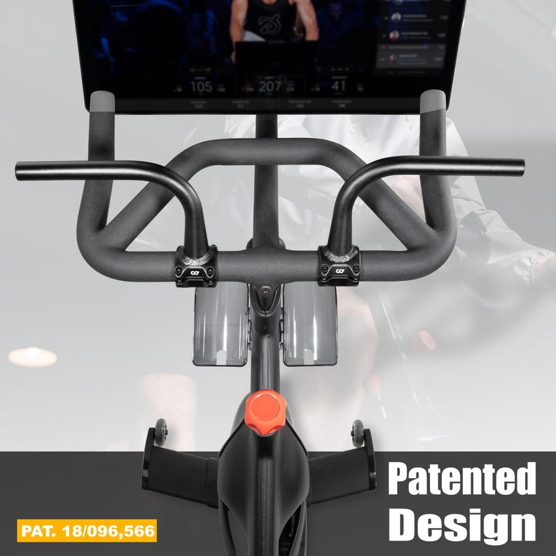 May include: A black exercise bike with a digital display showing workout metrics. The bike features a curved handlebar design, two water bottle holders, and an orange adjustment knob. The text "Patented Design" and "PAT. 18/096,566" are visible.