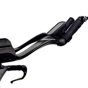 May include: Black triathlon bike handlebars with integrated armrests and a cycling computer. The handlebars have black tape. The image is set against a white background. The Gaviland 3D Solutions logo is in the bottom right corner.