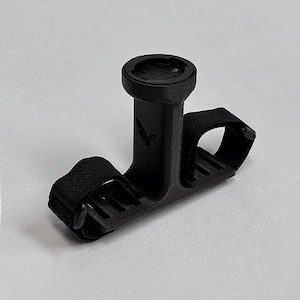 May include: A black bicycle computer mount with a circular top and a strap for securing to handlebars. The mount has a textured surface and a logo on the front. The Gaviland 3D Solutions logo is in the bottom right corner.