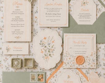 May include: A wedding stationery suite featuring cream-colored cards with peach floral illustrations, sage green envelopes, and a wax seal. The set includes a menu, invitation, details card, RSVP card with envelope, and a welcome note, all with elegant typography.