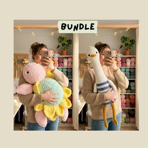 May include: A bundle of two handmade crochet plush toys. One is a pink and mint green turtle with yellow petal-like accents. The other is a white goose with blue stripes on its body and orange feet. The word BUNDLE is printed at the top.