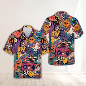 May include: A short-sleeve button-down shirt featuring a vibrant, multi-colored psychedelic print. The design includes a three-eyed cat, a unicorn, a boombox, a disco ball, a dinosaur, a smiling sun, and the text Groove City on a black background.