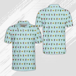 May include: A light blue short-sleeved polo shirt featuring a repeating pattern of tropical icons including palm trees, hibiscus flowers, and tiki-style mugs. The shirt has a classic collar, a buttoned placket, and a straight hemline design.