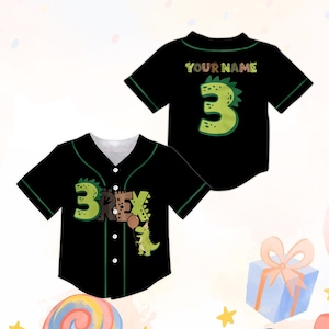 May include: A black baseball jersey with green trim, featuring a front graphic of a green dinosaur and the text 3 REX. The back of the jersey displays a large green number 3 and the text YOUR NAME in a brown, dinosaur-themed font style.