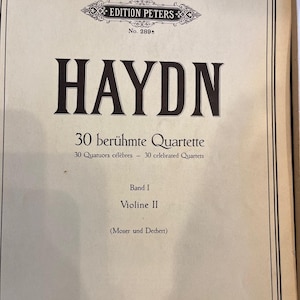 May include: Sheet music cover for Haydn's "30 berühmte Quartette" featuring the text "HAYDN" in large, bold letters. The cover includes the "EDITION PETERS" logo and text in German, French, and English. The text "Violine II" is also visible.