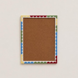 Multicoloured scalloped handprinted picture frame