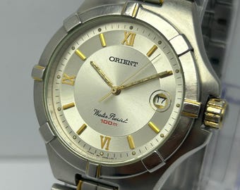 Vintage Orient UN4B-D0 Quartz Men Watch Silver Dial Two Tone Japan 36mm