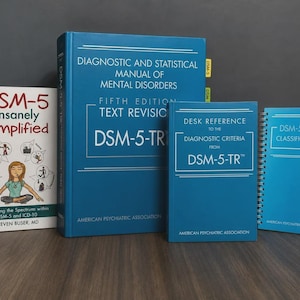May include: A collection of four books including the Diagnostic and Statistical Manual of Mental Disorders DSM-5-TR, a Desk Reference, a spiral-bound DSM-5-TR Classification guide, and a white book titled DSM-5 Insanely Simplified by Steven Buser, MD.
