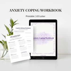 May include: A digital tablet shows an "Anxiety Coping Workbook" with a floral design and the text "Gentle tools for calm, clarity and emotional support." Two worksheets are visible, one titled "Cognitive Reframe Worksheet" and the other "Self-Soothing Menu."