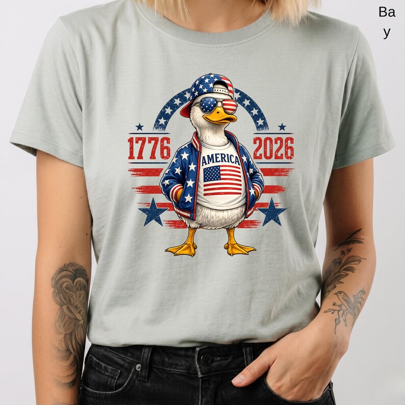 Patriotic eagle shirt featuring America 250th anniversary 1776 2026 graphic on light gray unisex t-shirt.