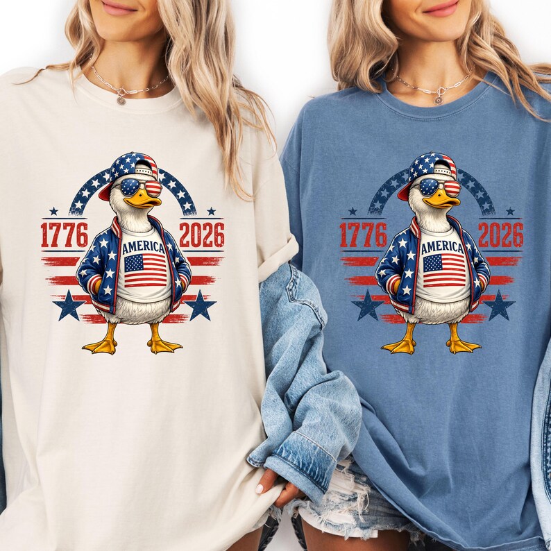 Folded blue t-shirt displaying America 250th anniversary eagle graphic with patriotic stars and 1776 2026 design.