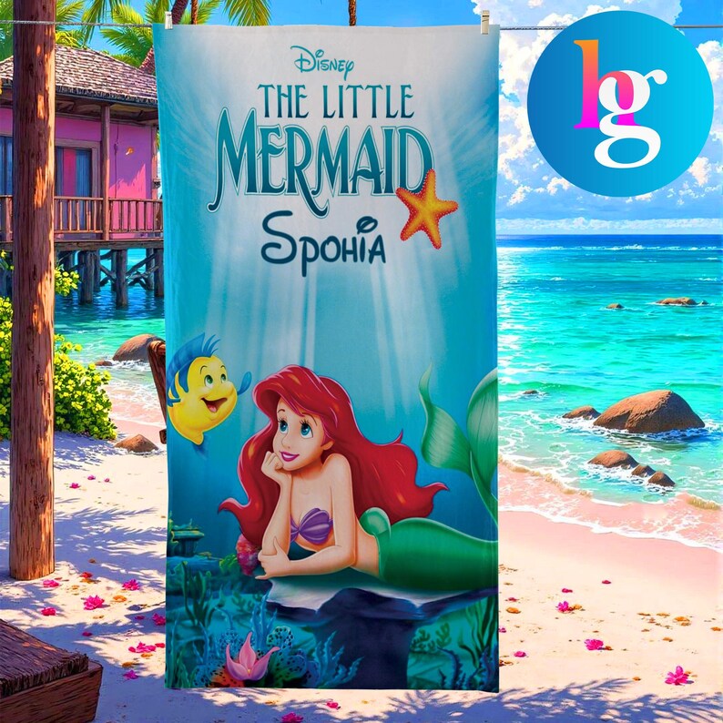 a poster for the Disney animated film "The Little Mermaid" with a mermaid character and a fish. The poster is displayed on a beach with palm trees and a clear blue sky in the background.