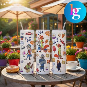 Three colorful tumblers with cartoon animal stickers, including a sloth, a fox, and a lion, are displayed on a wooden table.