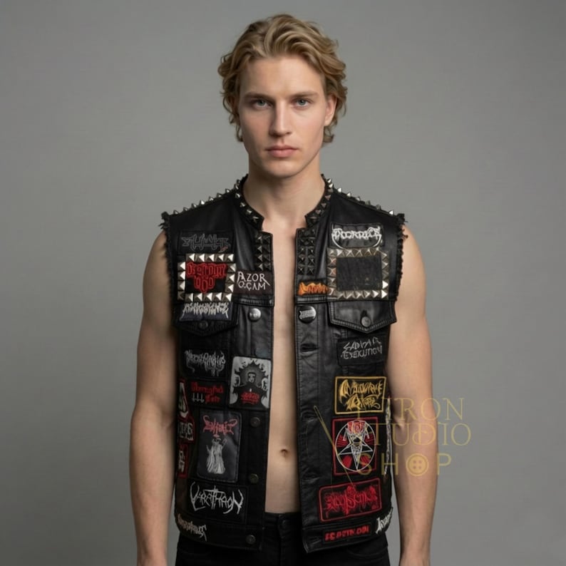 Front view of black leather studded vest open over a white distressed t-shirt.