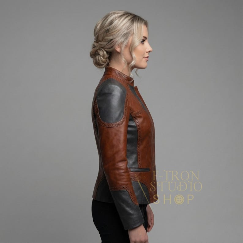 Side profile of a women's custom leather jacket showcasing brogue detailing on shoulder.
