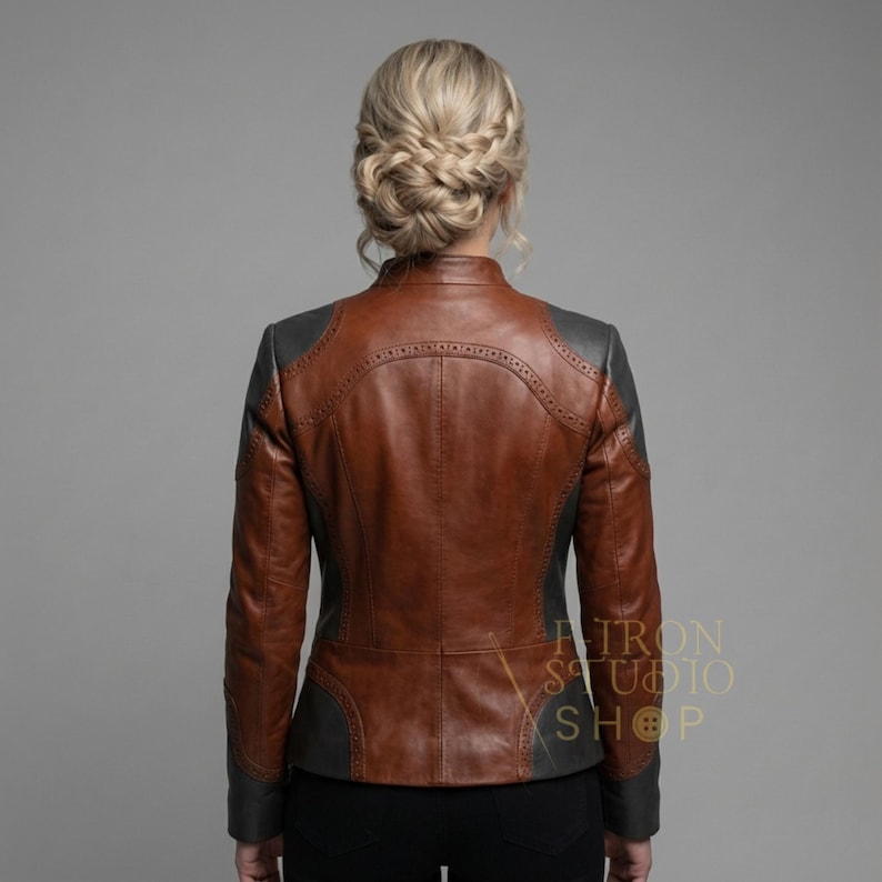 Rear view of a fitted women's handmade brown and gray leather brogue jacket.