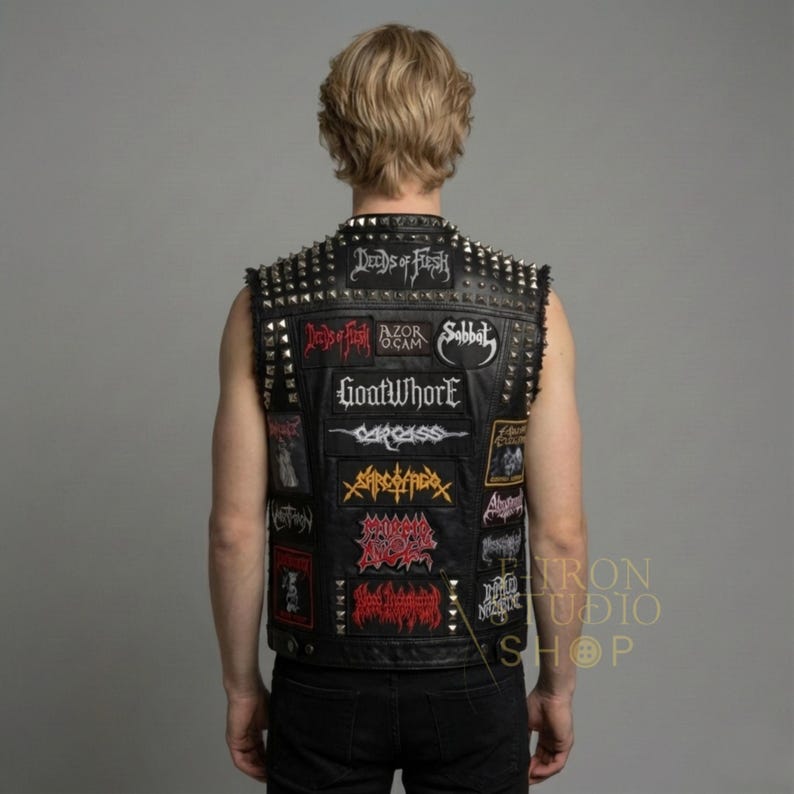 Mens black leather studded battle vest with heavy metal band patches back view.