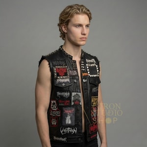 Profile view of men's custom leather vest showcasing pyramid studs and various patches.