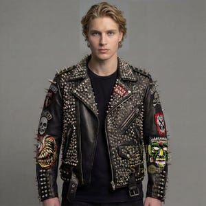 May include: Black leather jacket covered in silver studs and spikes. The jacket features multiple patches with skull and monster designs. It has a zipper closure and a buckled belt at the waist. A bold, edgy fashion statement.