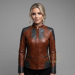 Front view of a model wearing a stylish two tone leather fashion jacket for women.