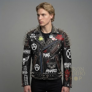 May include: Black leather jacket with silver spikes on the shoulders and collar. The jacket features patches and painted designs with the words "Sex Pistols", "Ramones", "Punx", "Anarco", and "Misfits".