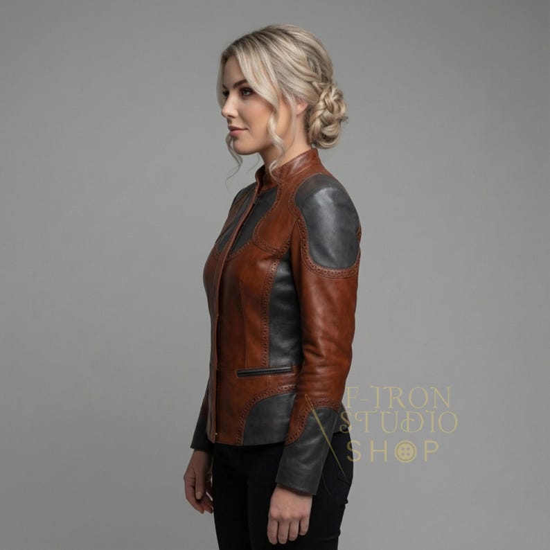 Side profile of a women's custom leather jacket showcasing brogue detailing on shoulder.