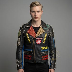 May include: Black leather jacket with silver studs, patches, and zippers. The jacket has red, yellow, and blue accents, and the text "Final Conflict" and "XRAY SEX" are visible on the front.