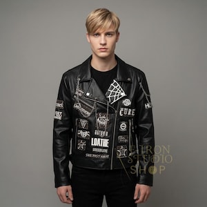 May include: Black leather jacket with multiple patches and silver chain accents. Patches include text and graphic designs. The jacket has a zipper closure and a classic biker style.