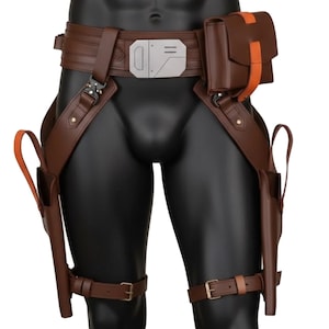 May include: Brown leather utility belt with holsters and pouches. The belt features a silver buckle and orange accents. The holsters are designed to hold two pistols. The belt is worn on a mannequin.