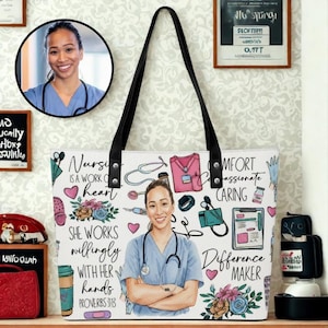 May include: White tote bag featuring a nurse illustration and medical-themed doodles. The bag has black handles and includes text such as "Nurse is a work of heart" and "Difference Maker". A portrait of a smiling nurse is also featured.