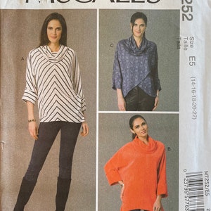 May include: Sewing pattern for a cowl neck top with three different style variations. The pattern is for sizes 14-16-18-20-22 and is from McCall's pattern number M7252.