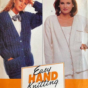 May include: A pattern for knitting two cardigans. The first cardigan is blue and the second is white. The pattern includes instructions and blocking tissue. The pattern number is H307 and the price is $2.25.