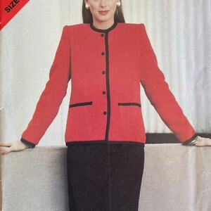 May include: A red and black jacket and skirt set. The jacket has a black trim and buttons. The skirt is black and knee-length. See & Sew 5060 Size B (14-16-18)