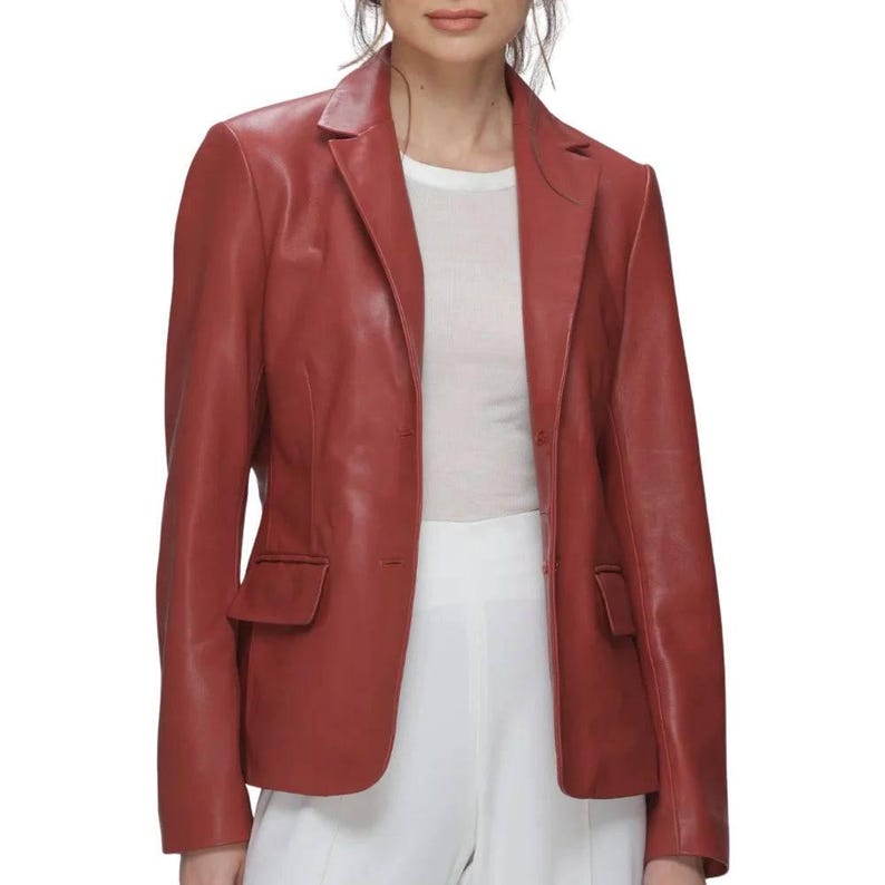Red Leather Blazer in premium genuine lambskin, featuring a tailored single-breasted notch lapel profile, single button closure, and classic side flap pockets, styled elegantly with high-waisted white trousers.