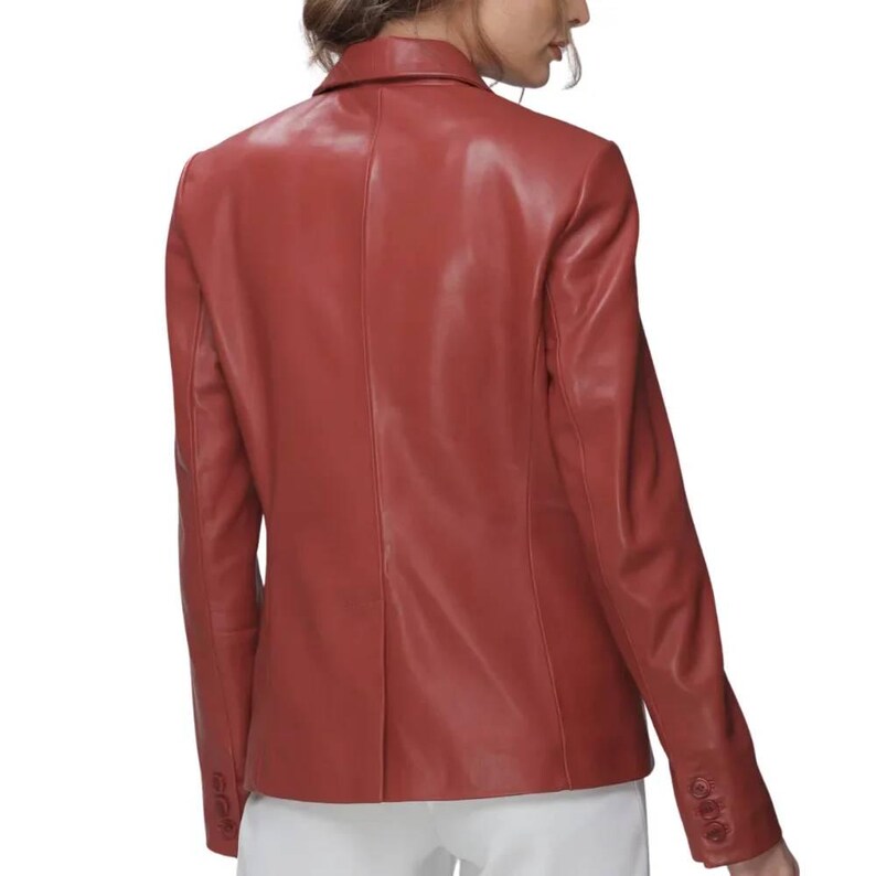 Red Leather Blazer in premium genuine lambskin, featuring a tailored single-breasted notch lapel profile, single button closure, and classic side flap pockets, styled elegantly with high-waisted white trousers.