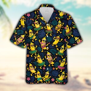 Maglietta hawaiana con banana che ride, divertente maglietta Aloha con banana danzante e motivo di foglie tropicali, ukulele e hula, ideale come regalo per le vacanze al mare e l'estate.