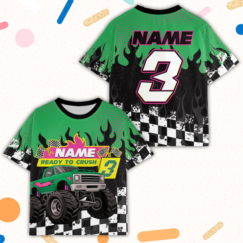 May include: Green and black short-sleeved t-shirt with a monster truck graphic. The shirt features the text "NAME" and "READY TO CRUSH" with the number "3". Flames and a checkered pattern are also visible.