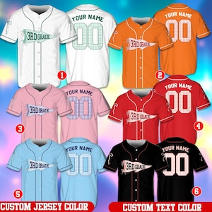 May include: A collection of short-sleeved button-down baseball jerseys in white, orange, pink, red, light blue, and black. Each jersey features a pennant graphic with the text 3rd GRADE on the front and YOUR NAME with the number 00 on the back.